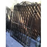 A LARGE PAIR OF WROUGHT IRON ORNATE GATES (EACH GATE 111CM X 164CM HIGH)