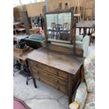 AN OAK DRESSING TABLE WITH THREE DRAWERS AND UPPER BEVEL EDGE MIRROR