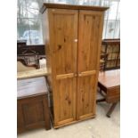 A PINE WARDROBE WITH TWO DOORS