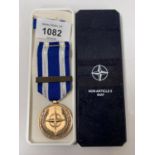 A REPRODUCTION NATO 'NONE-ARTICLE 5' ISAF MEDAL, BOXED
