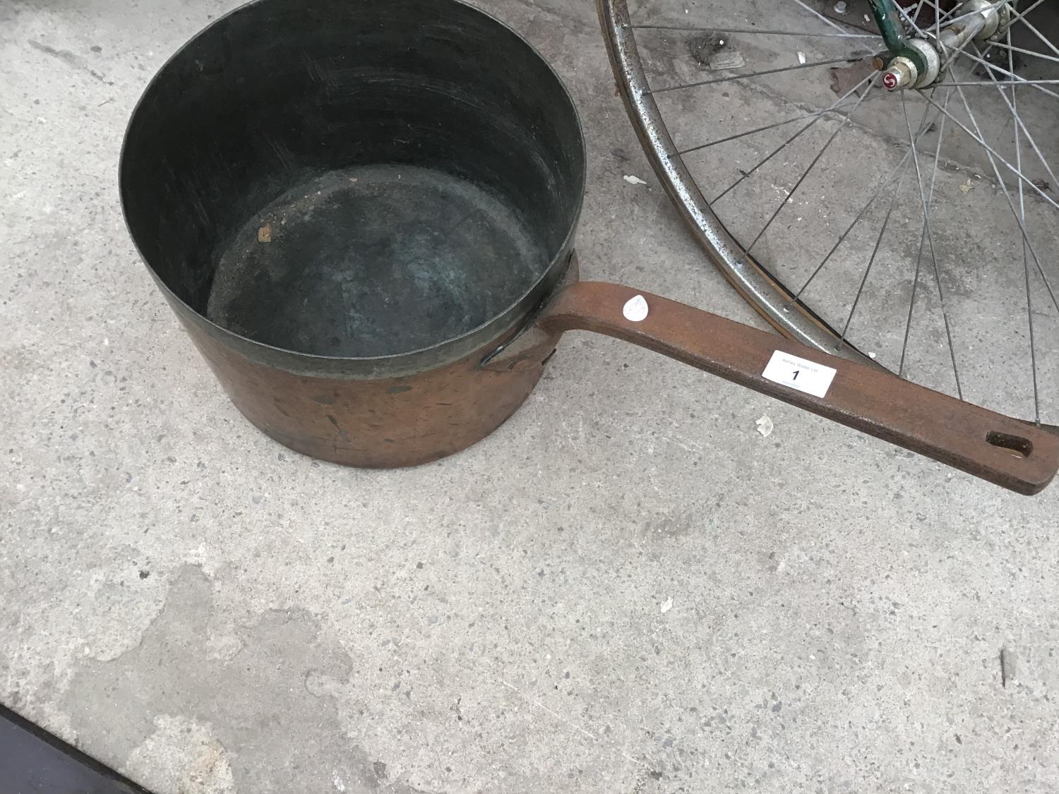 A VERY LARGE COPPER PAN