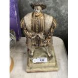 A HENRY THE VIII FIGURE ON HEAVY MARBLE EFFECT BASE