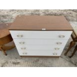 A TEAK EFFECT AND WHITE CHEST OF FOUR DRAWERS