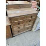 AN OAK CHEST OF TWO SHORT AND THREE LONG DRAWERS (SPLASHBACK NEEDS RE-ATTACHING)