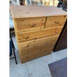 A PINE EFFECT CHEST OF TWO SHORT AND FOUR LONG DRAWERS