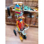 A VINTAGE TINPLATE WIND UP DUCK MODEL ON TRICYCLE