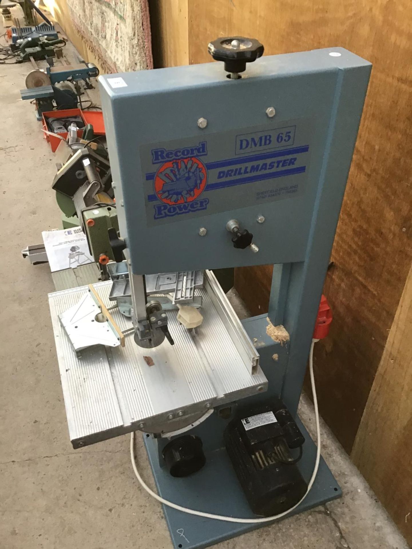A RECORD POWER DMB 65 DRILLMASTER BAND SAW IN WORKING ORDER