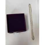 A SILVER NECK CHAIN, BOXED