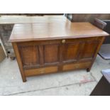 A 19TH CENTURY OAK MULE CHEST WITH HINGED TOP PANELLED FRONT AND TWO LOWER DRAWERS