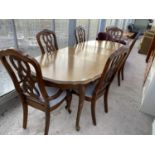 AN EXTENDING MAHOGANY DINING TABLE WITH FOUR CHAIRS AND TWO CARVERS