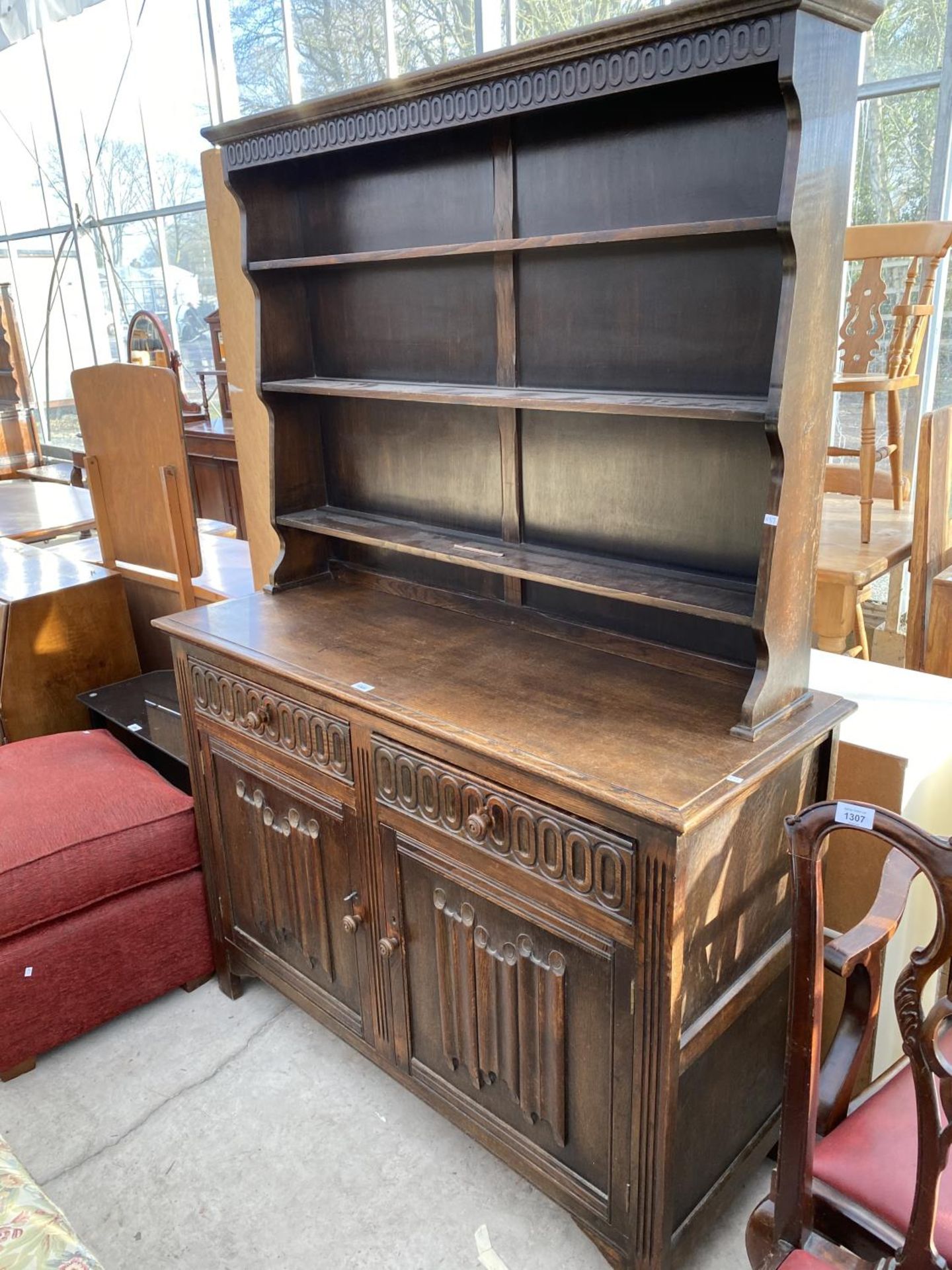 A PRIORY STYLE DRESSER WITH TWO DOORS, TWO DRAWERS AND UPPER PLATE RACK