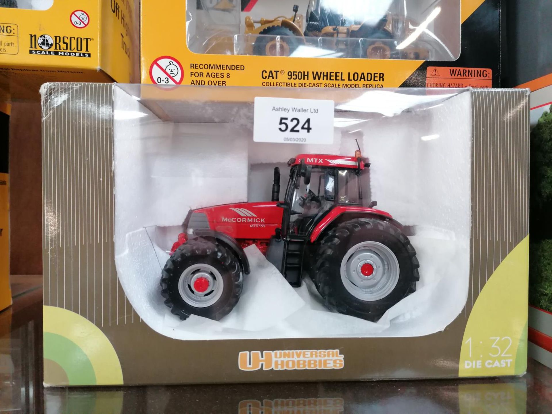 A BOXED DIE CAST UNIVERSAL HOBBIES MCCORMICK MTX 8 WHEEL TRACTOR MODEL, REF NO. 2396