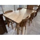 A PINE DINING TABLE WITH FOUR PINE DINING CHAIRS AND TWO CARVERS