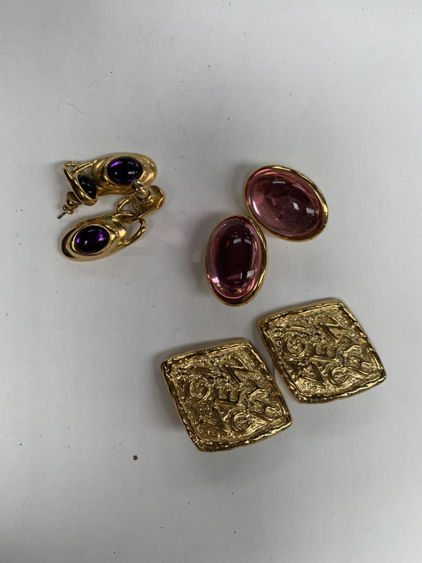 THREE PAIRS OF LADIES EARRINGS TO INCLUDE GIVENCHEY CLIP ONS AND TRIFARI EXAMPLES