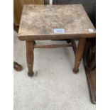 A SMALL OAK STOOL