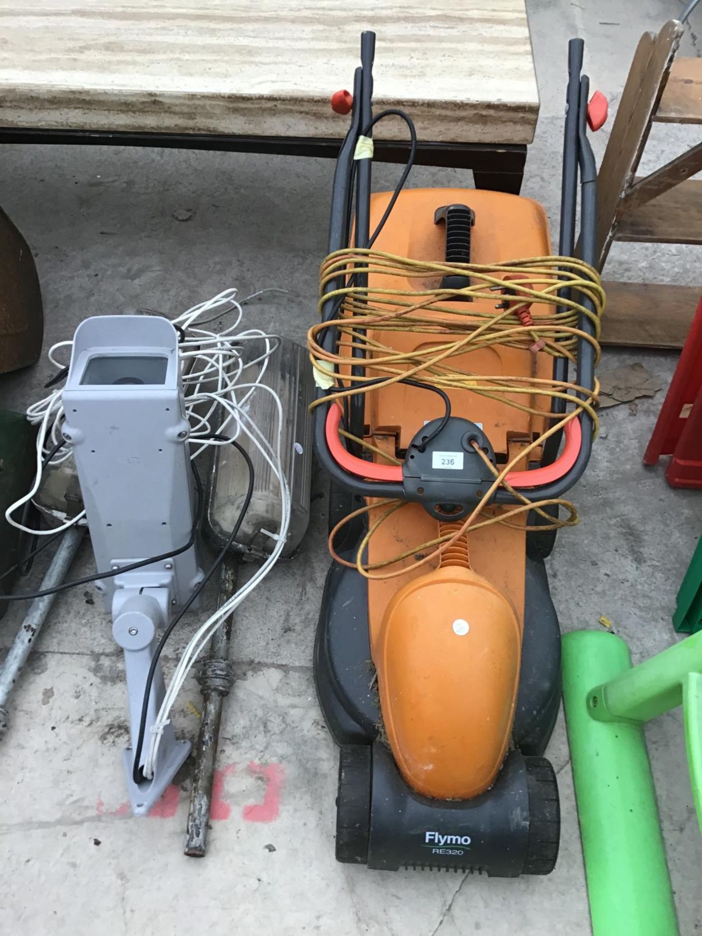 A FLYMO RE320 LAWNMOWER IN WORKING ORDER, TWO OUTSIDE LIGHTS AND A SECURITY CAMERA