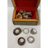 AN INLAID BOX TOGETHER WITH A LARGE COLLECTION OF COSTUME JEWELLERY RINGS