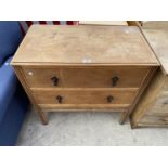 AN OAK CHEST OF TWO DRAWERS