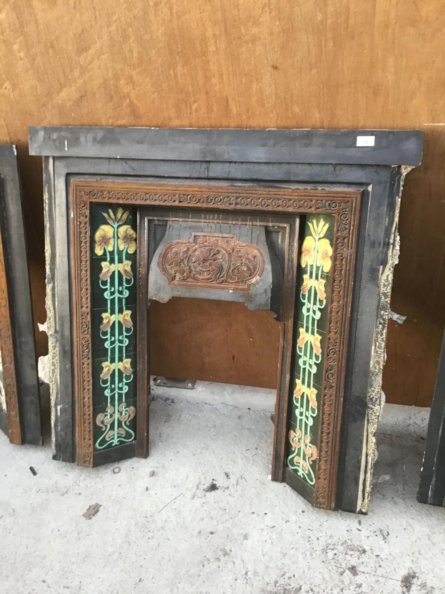 A ORNATE TILE SIDED CAST IRON FIRE PLACE 102CM X 100CM HIGH