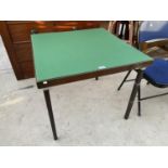 A FOLDING CARD TABLE WITH GREEN BAIZE TOP