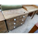 A RUSTIC PINE CHEST OF TWO SHORT AND TWO LONG DRAWERS