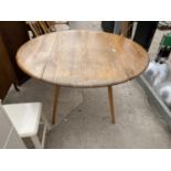 AN ERCOL OVAL ELM DROP LEAF DINING TABLE