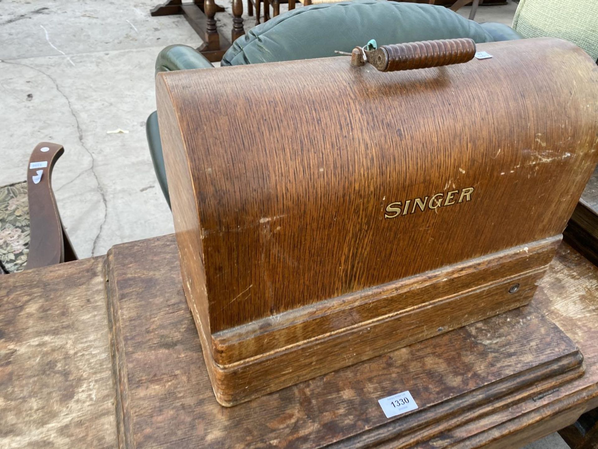 A SINGER ELECTRIC SEWING MACHINE ON A TREADLE BASE - Image 2 of 4