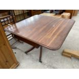 A MAHOGANY DROP LEAF DINING TABLE