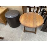 A LEATHERETTE STOOL ON SWIVEL SUPPORT AND A SMALL OAK OCCASIONAL TABLE