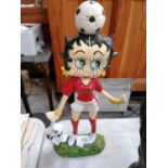 A CAST METAL BETTY BOOP DOOR STOP MODEL IN RED FOOTBALL KIT