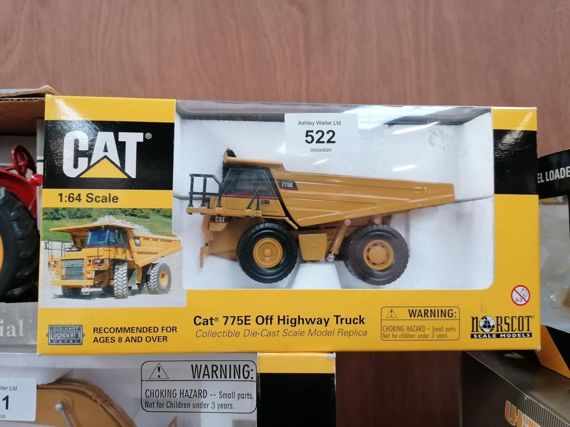 A BOXED NORSCOT DIE CAST CAT 775 E OFF HIGHWAY TRUCK MODEL, 1:64 SCALE, REF NO. 55095