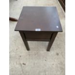 A SMALL MAHOGANY SEWING TABLE WITH HINGED TOP AND LINED INTERIOR