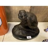 A BRONZE NUDE FIGURE ON A MARBLE BASE