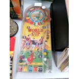 A VINTAGE WORLD CUP FOOTBALL PORTABLE PIN BALL GAME