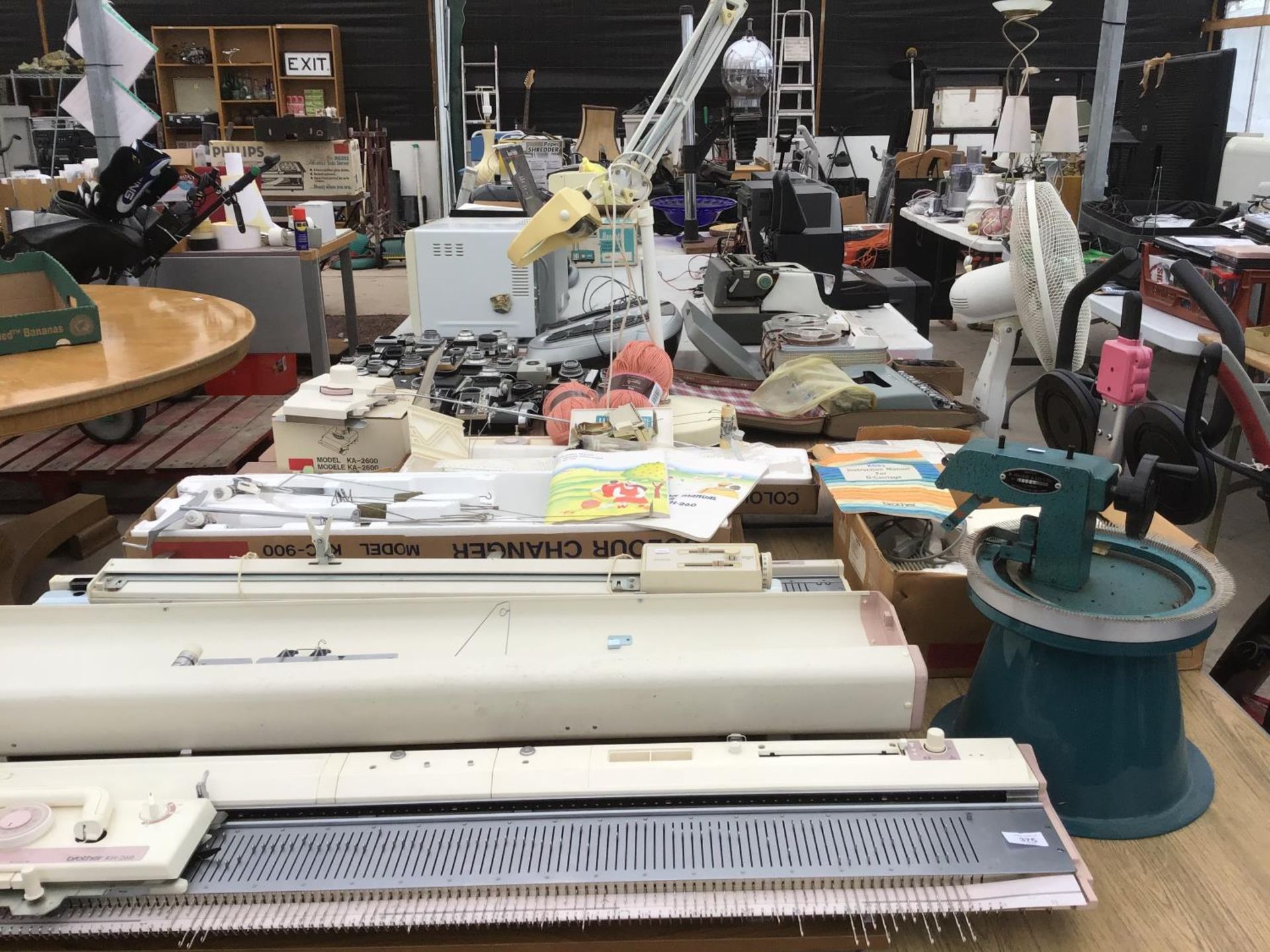 TWO BROTHER KNITTING MACHINES (ONE CASED) AND A LARGE QUANTITY OF ATTACHMENTS AND ACCESSORIES TO