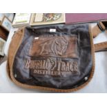 A BUFFALO TRACE DISTILLERY LEATHER AND CANVAS BAG