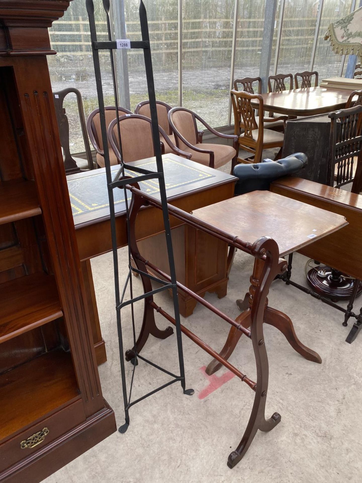 AN IRON PAN STAND AND A MAHOGANY TOWEL RAIL