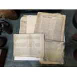 AN ASSORTMENT OF VARIOUS NEWSPAPERS AND PAPER WORK