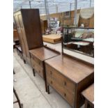 AN OAK THREE PIECE BEDROOM SUITE - A CHEST OF TWO DRAWERS AND DRESSING TABLE AND A WARDROBE WITH TWO