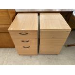 TWO BEECH EFFECT BEDSIDE CHESTS OF THREE DRAWERS