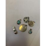 AN ASSORTMENT OF SIX SILVER PENDANTS