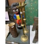 A TALL PAIR OF BRASS CANDLE STICKS