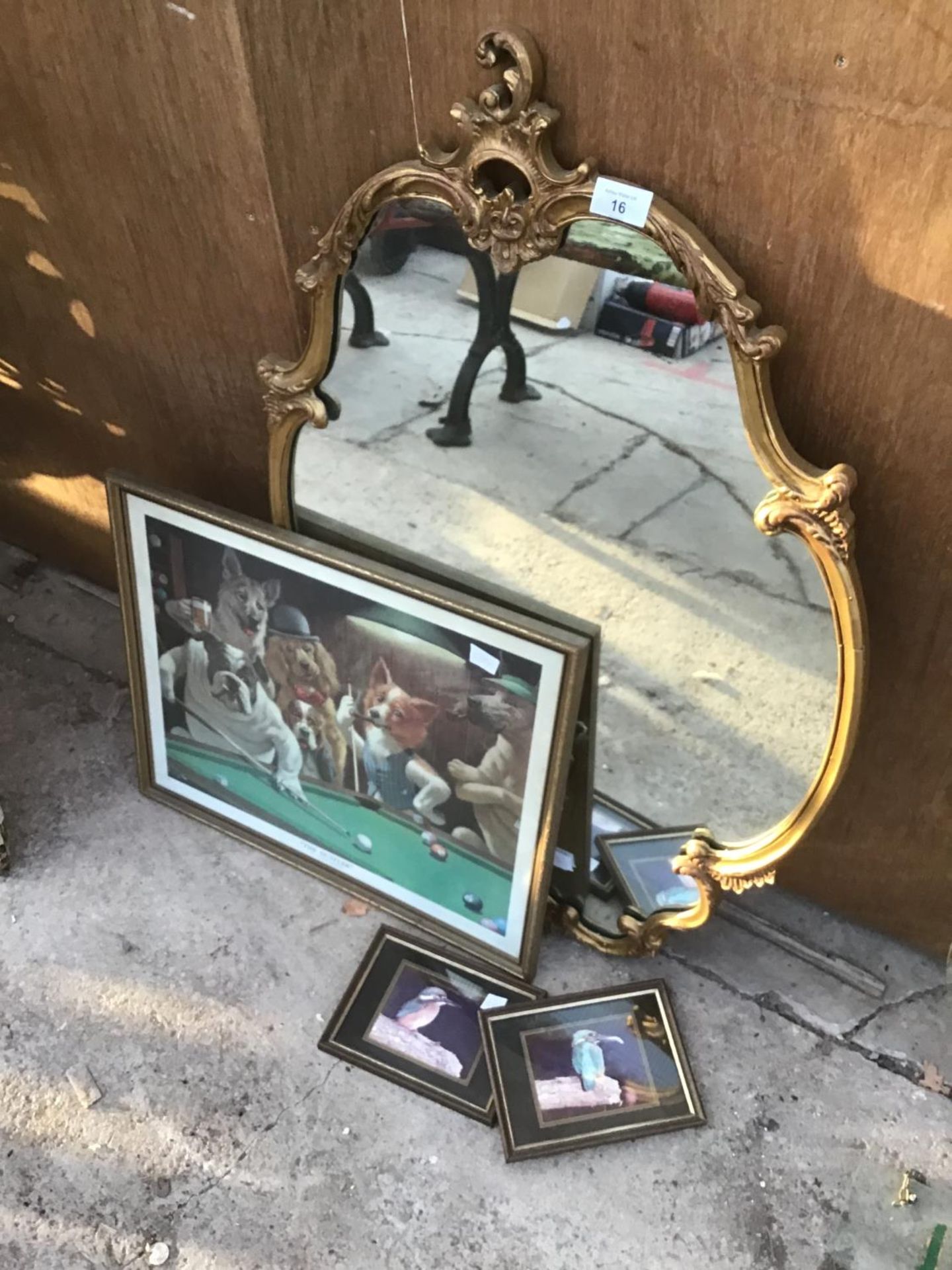 AN ORNATE GILT FRAMED MIRROR AND THREE PICTURES TO INCLUDE DOGS PLAYING POOL