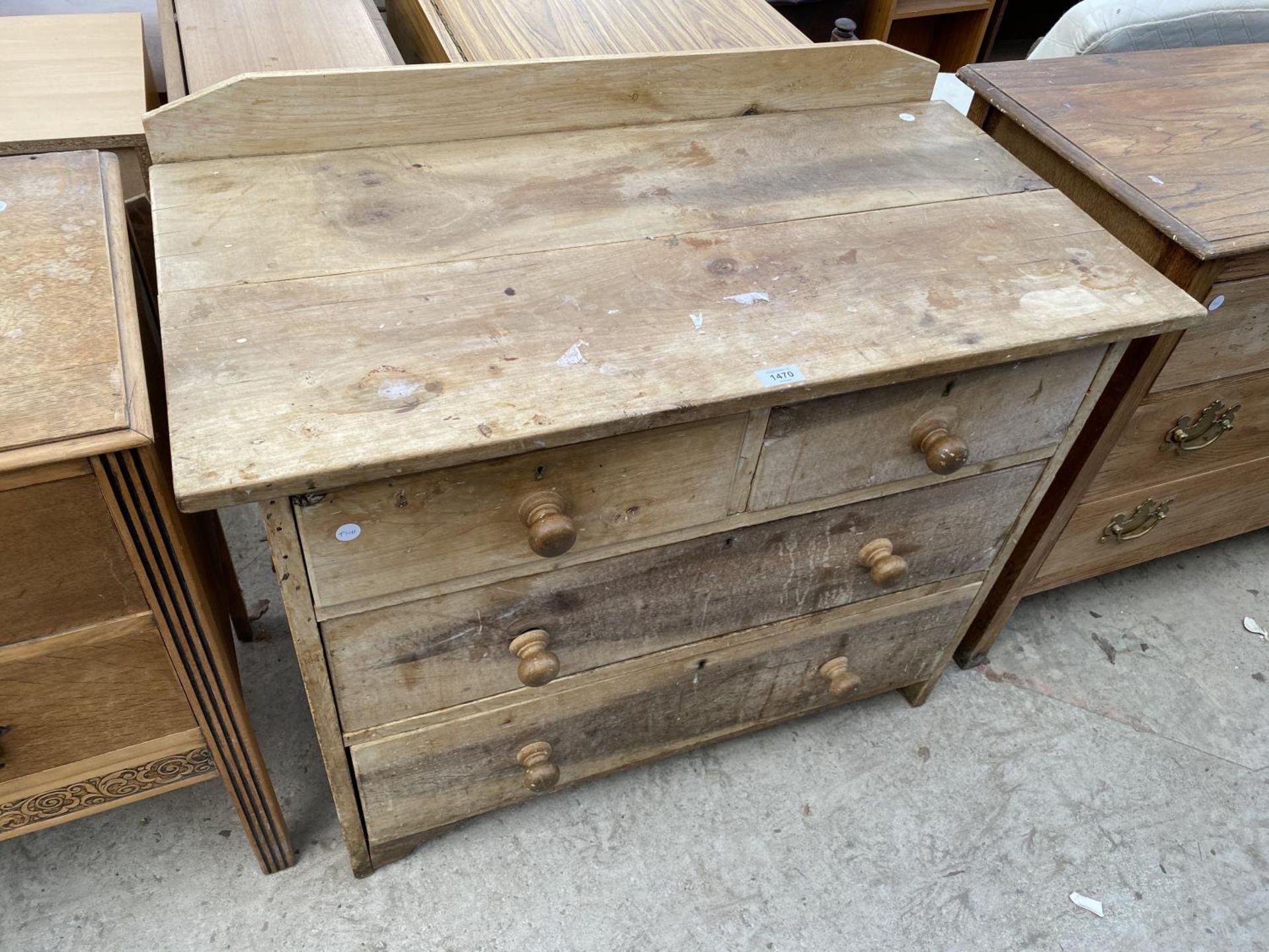 A RUSTIC PINE CHEST OF TWO SHORT AND TWO LONG DRAWERS