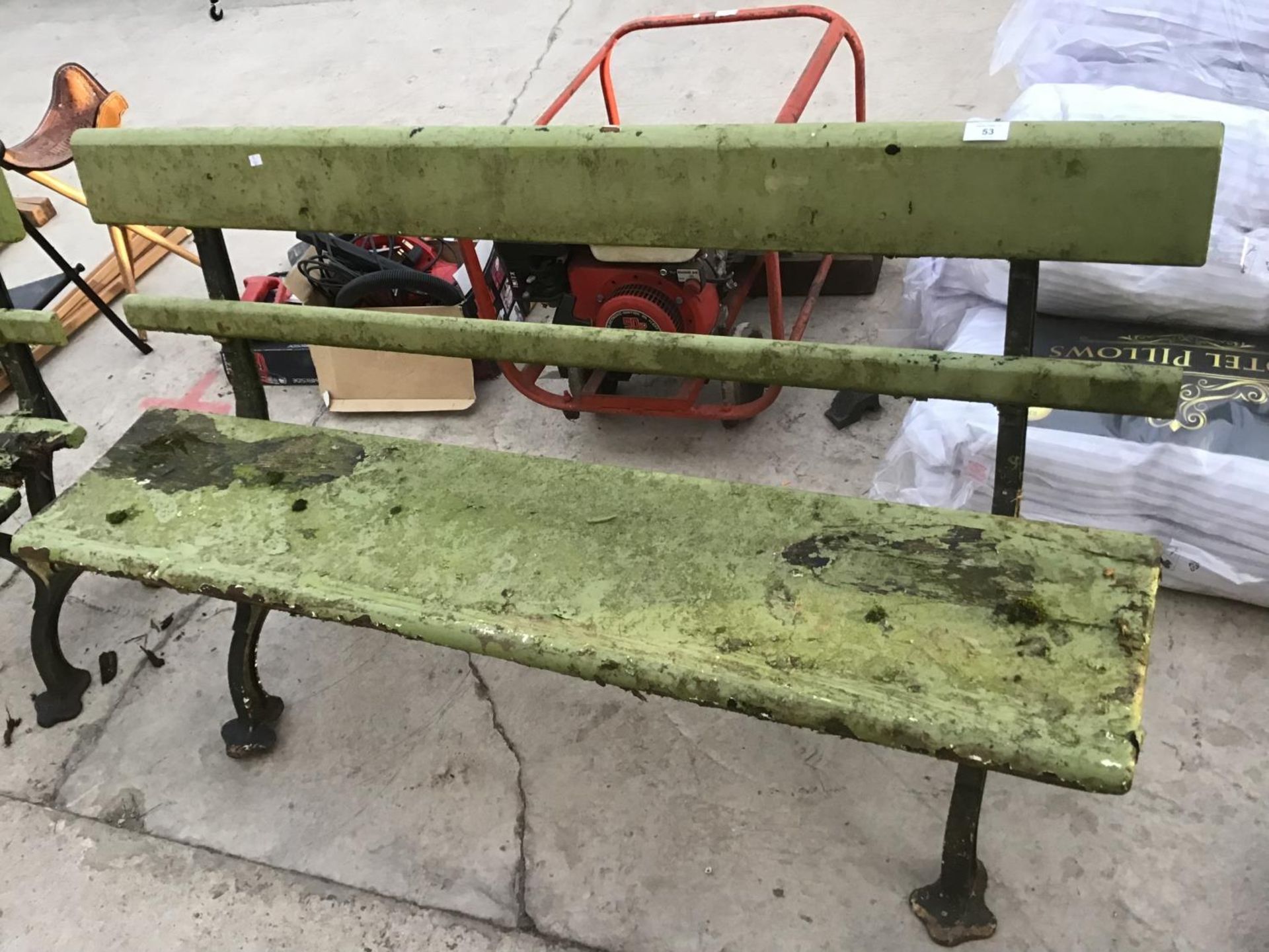 TWO WOODEN BENCHES ON CAST IRON SUPPORTS IN NEED OF RESTORATION - Image 2 of 4