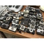 A LARGE COLLECTION OF CAMERAS TO INCLUDE KODAK, HANIMEX, ILFORD ETC