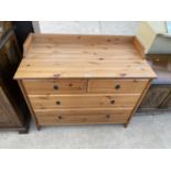 A PINE EFFECT CHEST OF TWO LONG AND TWO SHORT DRAWERS