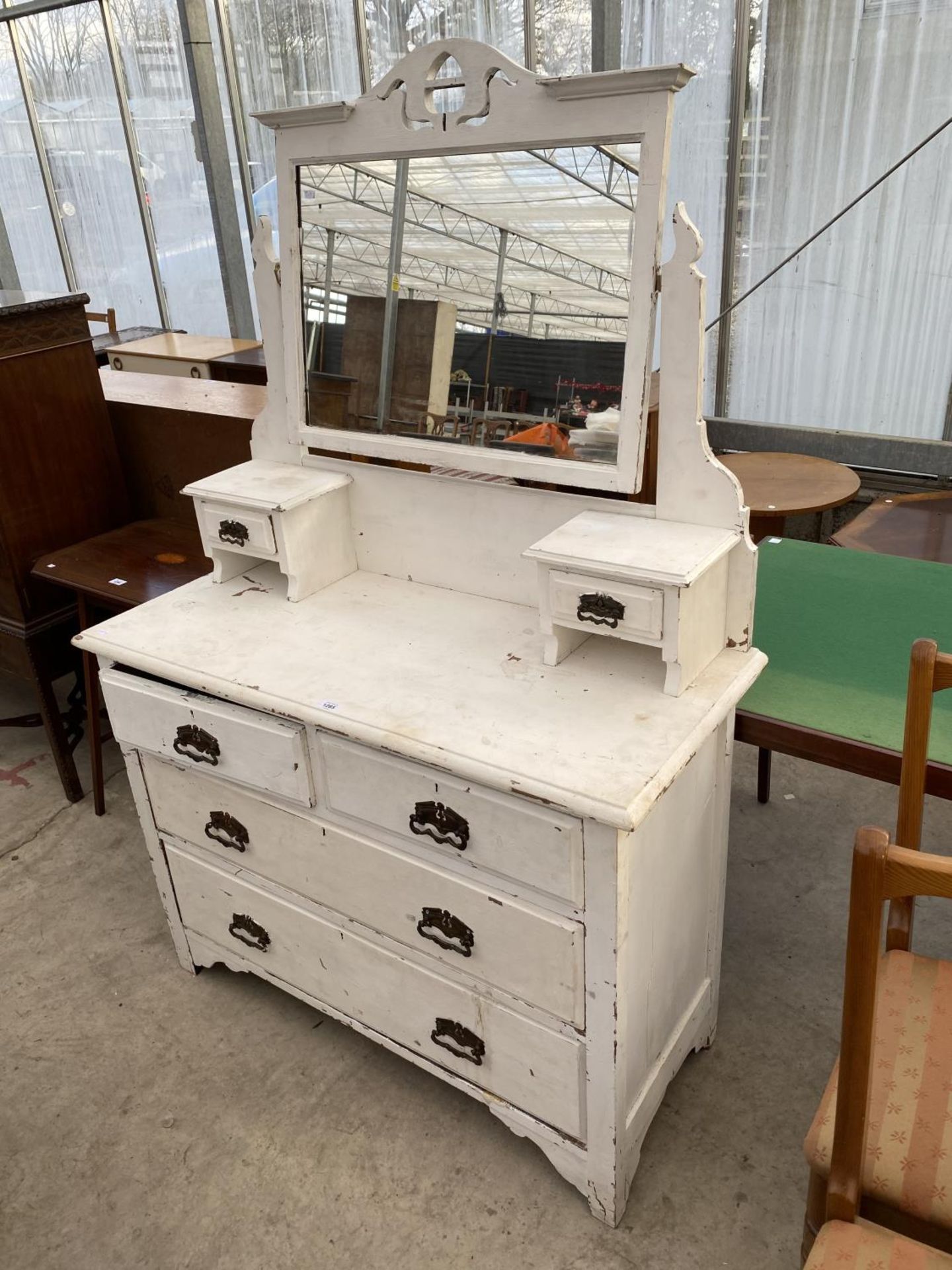 A WHITE PAINTED DRESSING TABLE WITH TWO LONG AND TWO SHORT DRAWERS, TWO SMALL UPPER DRAWERS AND