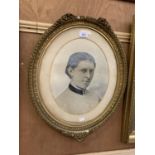 AN OVAL FRAMED VICTORIAN PICTURE