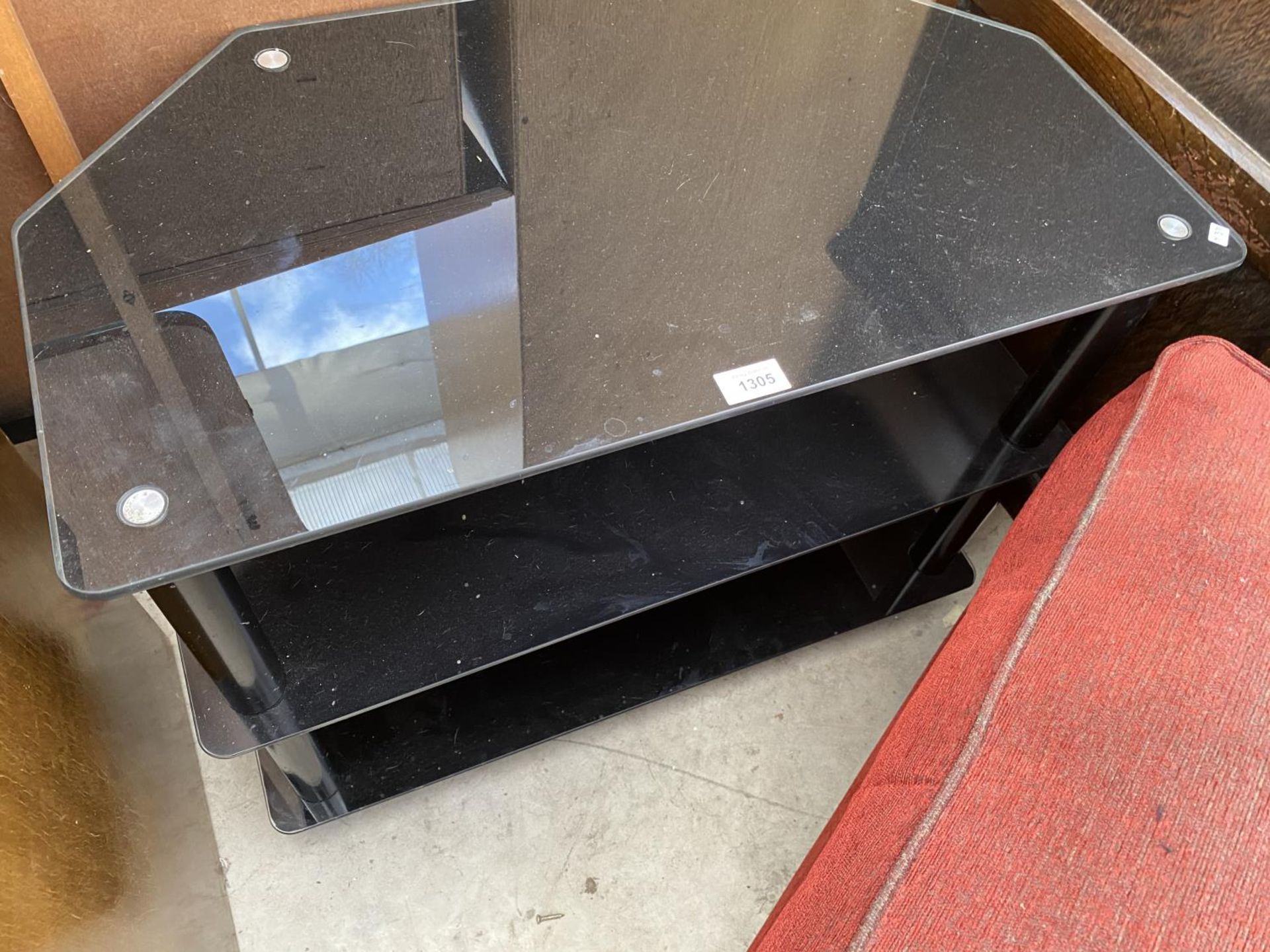 AN UPHOLSTERED FOOTSTOOL AND A BLACK GLASS TV STAND - Image 2 of 2